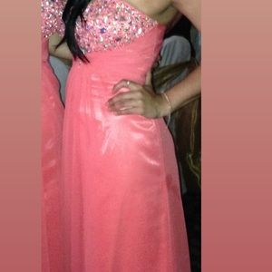 Beautiful strapless coral dress in excellent condition. All beading intact.